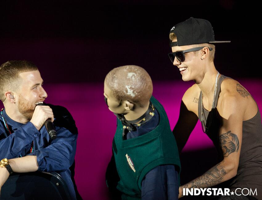Justin Bieber pranks Mike Posner onstage during his performance on the Believe Tour in Indianapolis, IN 7/10/13
Photo by IndyStar.com
