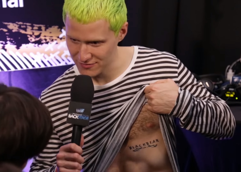 Mike Posner's left side chest Blackbear name tattoo says "Blackbear Rest In Peace".
