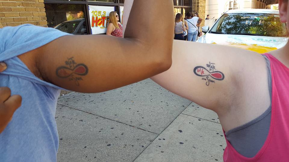 Relate Love Inspire matching tattoos
